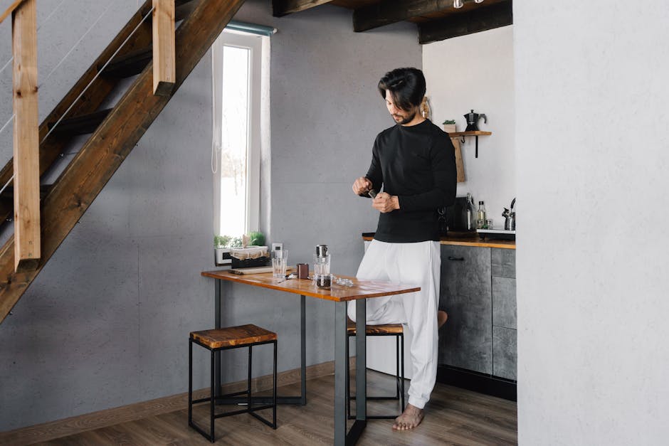 Person of bigger build smiling while doing a simple yoga stretch at home